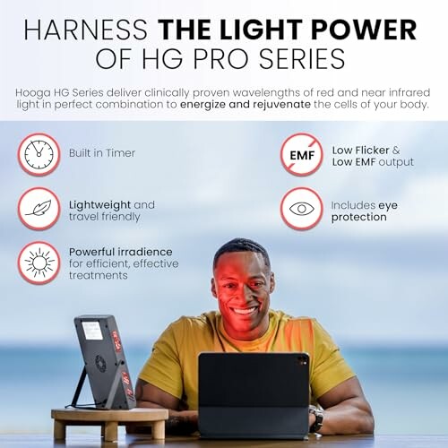 Man using Hooga HG Pro Series light therapy device at a desk.