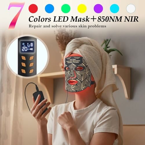 Person using an LED light therapy mask with handheld control.